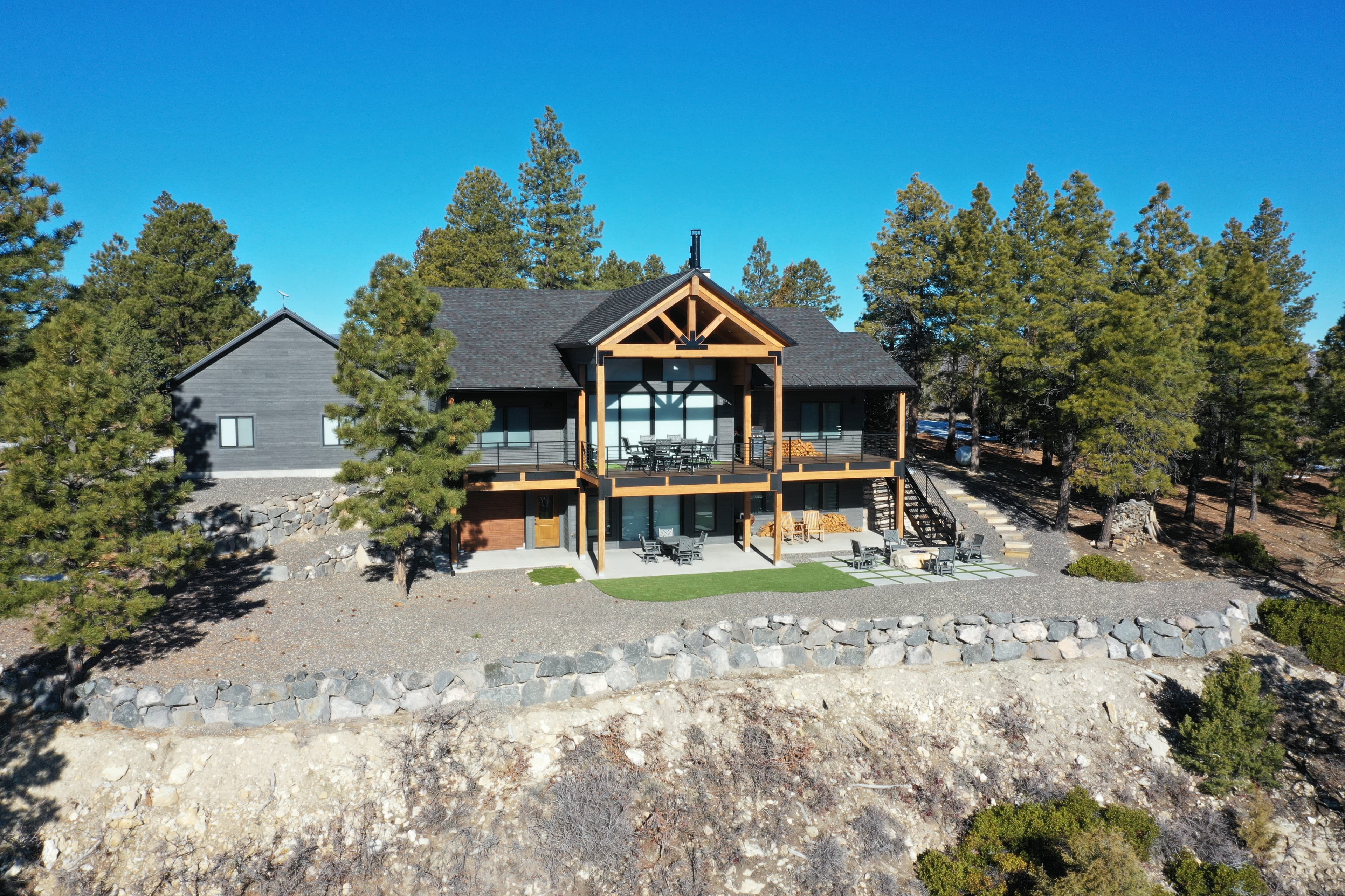 Aerial drone photograph of a luxury home surrounded by pines in southern Utah — real estate showreel